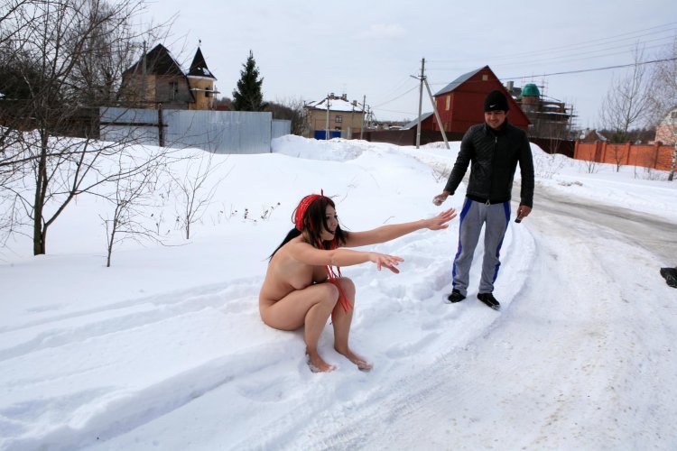 Naked women in the winter in the village