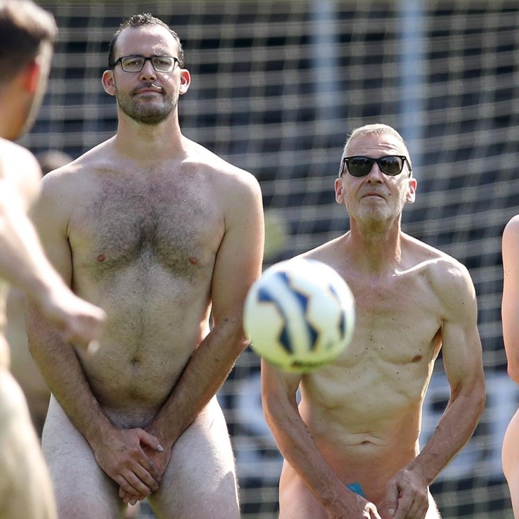 Naked football players on the field