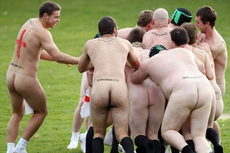 Naked football players on the field