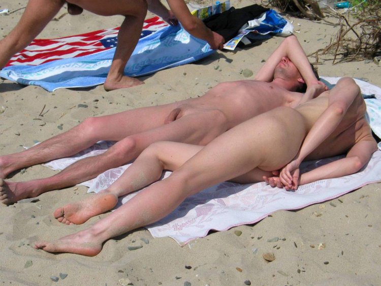 Naked nudists on the beach